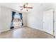 Bedroom features tile floors, ceiling fan and window with curtains at 1108 Sidehill Way, Las Vegas, NV 89110
