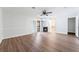 Primary bedroom boasts wood-look floors, a ceiling fan, fireplace, and sliding door to the backyard at 1108 Sidehill Way, Las Vegas, NV 89110