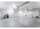 Spacious garage featuring epoxy floors, ample lighting and room for storage at 1108 Sidehill Way, Las Vegas, NV 89110