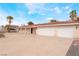 Spacious three-car garage and expansive driveway of a single-story home at 1108 Sidehill Way, Las Vegas, NV 89110