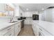 Bright updated kitchen featuring white cabinets, an island, and stainless steel appliances at 1108 Sidehill Way, Las Vegas, NV 89110