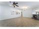 Spacious living room featuring a tile fireplace and arched entryways with views to other rooms at 1108 Sidehill Way, Las Vegas, NV 89110