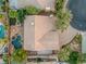 Aerial view showcasing a landscaped property with pool, spa, outdoor kitchen, and a tile roof at 11158 Antonine Wall Ct, Las Vegas, NV 89141