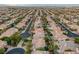 An aerial perspective shows a well-organized community, with consistent architectural styles and manicured landscaping at 11158 Antonine Wall Ct, Las Vegas, NV 89141
