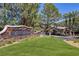 The gated entrance to Royal Highlands features a stone sign, manicured lawn, and security gate for resident privacy at 11158 Antonine Wall Ct, Las Vegas, NV 89141
