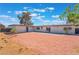 Spacious backyard with gravel, concrete patio, and desert landscaping at 1202 Arrowhead Ave, Las Vegas, NV 89106