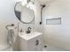 Renovated bathroom features a modern sink, updated fixtures, and stylish tiling at 1202 Arrowhead Ave, Las Vegas, NV 89106