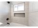 The bathroom features tiled shower with window and recessed shelf at 1202 Arrowhead Ave, Las Vegas, NV 89106