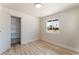 Inviting bedroom features a closet, light filled window and new floors at 1202 Arrowhead Ave, Las Vegas, NV 89106