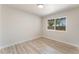 Bright bedroom featuring new floors and a sunlit window at 1202 Arrowhead Ave, Las Vegas, NV 89106