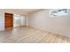 Cozy bedroom featuring updated flooring, a built-in closet, and a bright window at 1202 Arrowhead Ave, Las Vegas, NV 89106