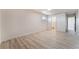 Spacious bedroom with ample natural light and new floors leading to an ensuite bathroom at 1202 Arrowhead Ave, Las Vegas, NV 89106