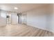 Open bedroom area offering updated floors, natural light, and an adjacent bathroom and closet at 1202 Arrowhead Ave, Las Vegas, NV 89106