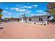 Exterior of home with xeriscaping, desert landscaping, and covered walkway at 1202 Arrowhead Ave, Las Vegas, NV 89106
