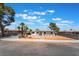 Home exterior showing xeriscaping, desert landscaping, walkway, and signage at 1202 Arrowhead Ave, Las Vegas, NV 89106