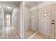 Inviting hallway with neutral tones, mirrored wall and access to multiple rooms at 1202 Arrowhead Ave, Las Vegas, NV 89106