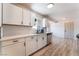 Contemporary kitchen featuring white cabinets, stainless steel appliances, and modern finishes at 1202 Arrowhead Ave, Las Vegas, NV 89106