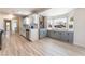 Bright kitchen featuring white cabinets, stainless steel appliances and a bay window with built-in storage at 1202 Arrowhead Ave, Las Vegas, NV 89106