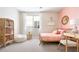 Charming bedroom with pink accents, cozy furniture, and lots of natural light at 1208 Crimson Sunbird St, North Las Vegas, NV 89084