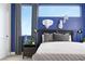 This bedroom boasts modern decor, a large window and a stylish color palette at 1208 Crimson Sunbird St, North Las Vegas, NV 89084
