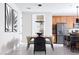 Contemporary dining area adjacent to a modern kitchen, with stylish decor and ample seating at 1208 Crimson Sunbird St, North Las Vegas, NV 89084