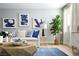 Cozy living room with a comfortable sofa, stylish artwork, a large fiddle leaf fig tree, and a geometric coffee table at 1212 Crimson Sunbird St, North Las Vegas, NV 89084
