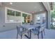 This home boasts a covered patio with an outdoor dining set for enjoying outdoor meals and relaxation at 1212 Crimson Sunbird St, North Las Vegas, NV 89084