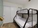 A bedroom with a bunk bed and minimalist decor at 1553 Dorothy Ave # 4, Las Vegas, NV 89119