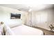 Bright bedroom featuring a king bed, TV, and ceiling fan at 1553 Dorothy Ave # 4, Las Vegas, NV 89119