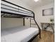 A bedroom with a bunk bed, neutral walls, and minimalist decor at 1553 Dorothy Ave # 4, Las Vegas, NV 89119