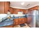 Functional kitchen featuring stainless steel appliances and warm wood cabinetry at 1553 Dorothy Ave # 4, Las Vegas, NV 89119