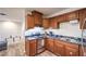 Functional kitchen with wood cabinets and a stainless steel range at 1553 Dorothy Ave # 4, Las Vegas, NV 89119