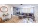 Cozy living area with a modern sofa, round mirror, and stylish decor at 1553 Dorothy Ave # 4, Las Vegas, NV 89119