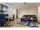 A well-lit living room featuring a dining area and a sectional sofa at 1553 Dorothy Ave # 4, Las Vegas, NV 89119
