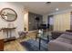 A well-lit living room with a dining area, featuring stylish furnishings and decor at 1553 Dorothy Ave # 4, Las Vegas, NV 89119