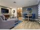 A well-lit living room with a dining area, featuring stylish furnishings and decor at 1553 Dorothy Ave # 4, Las Vegas, NV 89119