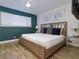 Main bedroom with a decorative headboard, a ceiling fan, and ample natural light at 1553 Dorothy Ave # 4, Las Vegas, NV 89119
