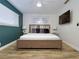 Main bedroom with a decorative headboard, a ceiling fan, and ample natural light at 1553 Dorothy Ave # 4, Las Vegas, NV 89119