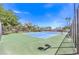 A well-maintained community tennis court with new nets, benches, and surrounded by mature trees at 1553 Dorothy Ave # 4, Las Vegas, NV 89119