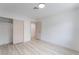 Bright bedroom with light wood floors, closet and entry door at 1808 E Saint Louis Ave, Las Vegas, NV 89104