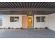 Inviting front entrance showcasing a bright yellow door and modern accents at 1808 E Saint Louis Ave, Las Vegas, NV 89104