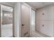 Hallway with storage cabinets and doorway to tiled bathroom at 1808 E Saint Louis Ave, Las Vegas, NV 89104