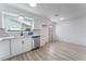 Bright, updated kitchen features stainless steel appliances and stylish white cabinetry at 1808 E Saint Louis Ave, Las Vegas, NV 89104