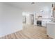 Open concept kitchen with stainless steel appliances and luxury vinyl plank flooring at 1808 E Saint Louis Ave, Las Vegas, NV 89104