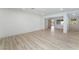 Spacious living room with light wood flooring, neutral color scheme, and natural light at 1808 E Saint Louis Ave, Las Vegas, NV 89104