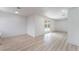Bright living room with light wood floors and backyard pool access through sliding glass doors at 1808 E Saint Louis Ave, Las Vegas, NV 89104