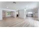 Open-concept living room and kitchen with light wood flooring, recessed lighting, and neutral color scheme at 1808 E Saint Louis Ave, Las Vegas, NV 89104