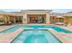 Luxurious backyard with a pool, spa, covered patio, and ample space for entertaining at 21 Grand Masters Dr, Las Vegas, NV 89141