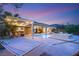 Backyard pool, spa, hammock, and dining area create an ultimate outdoor oasis for relaxation at 21 Grand Masters Dr, Las Vegas, NV 89141