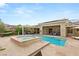 Outdoor oasis with a pool, spa, patio, and lounging area for ultimate relaxation at 21 Grand Masters Dr, Las Vegas, NV 89141